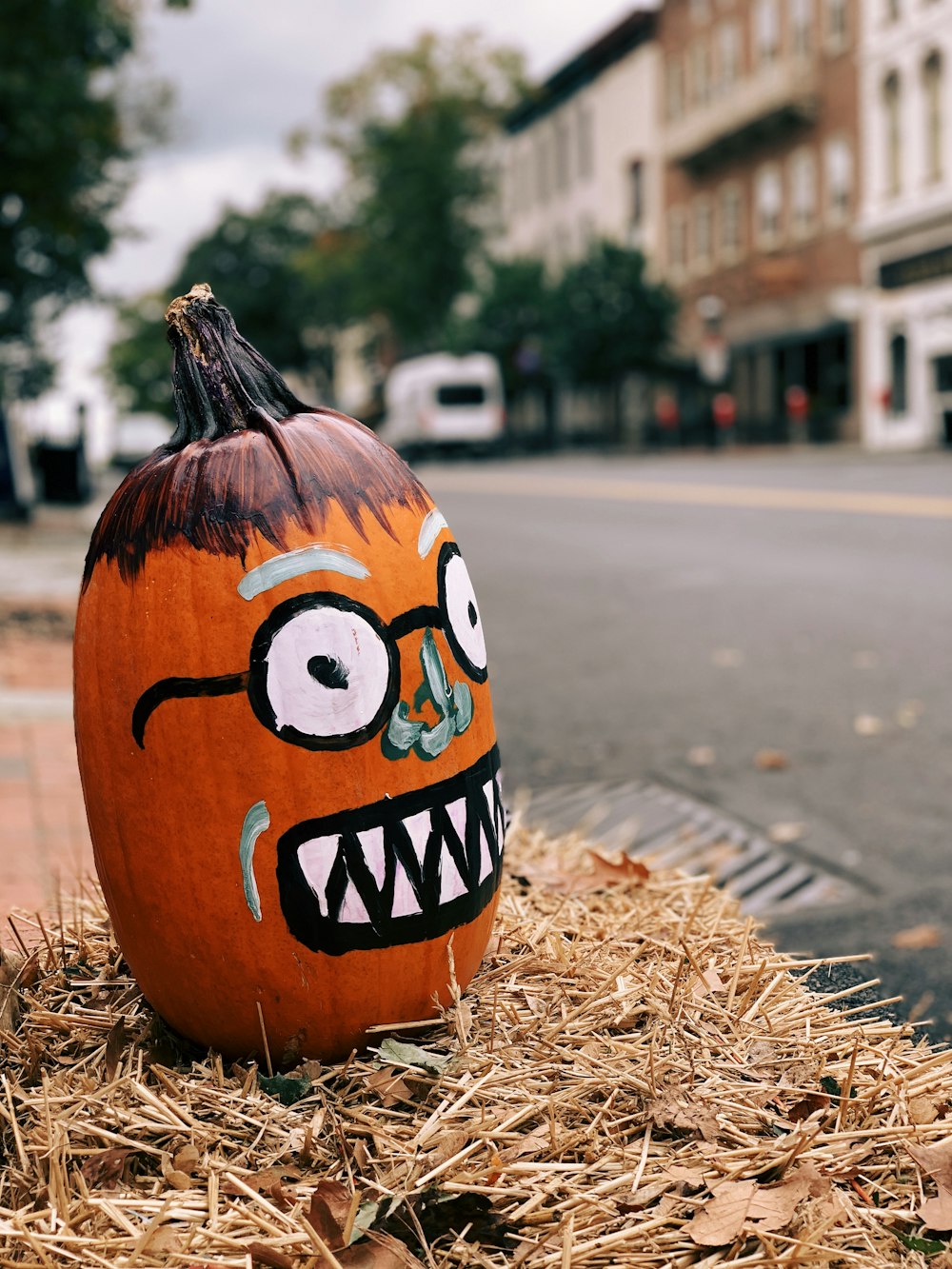 pumpkin on hay near street