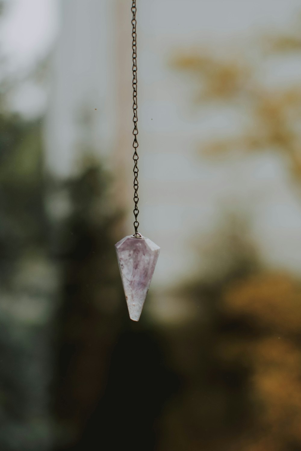clear crystal hanging on chain