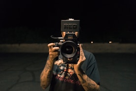 person holding video camera