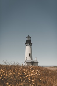 lighthouse under blue sky