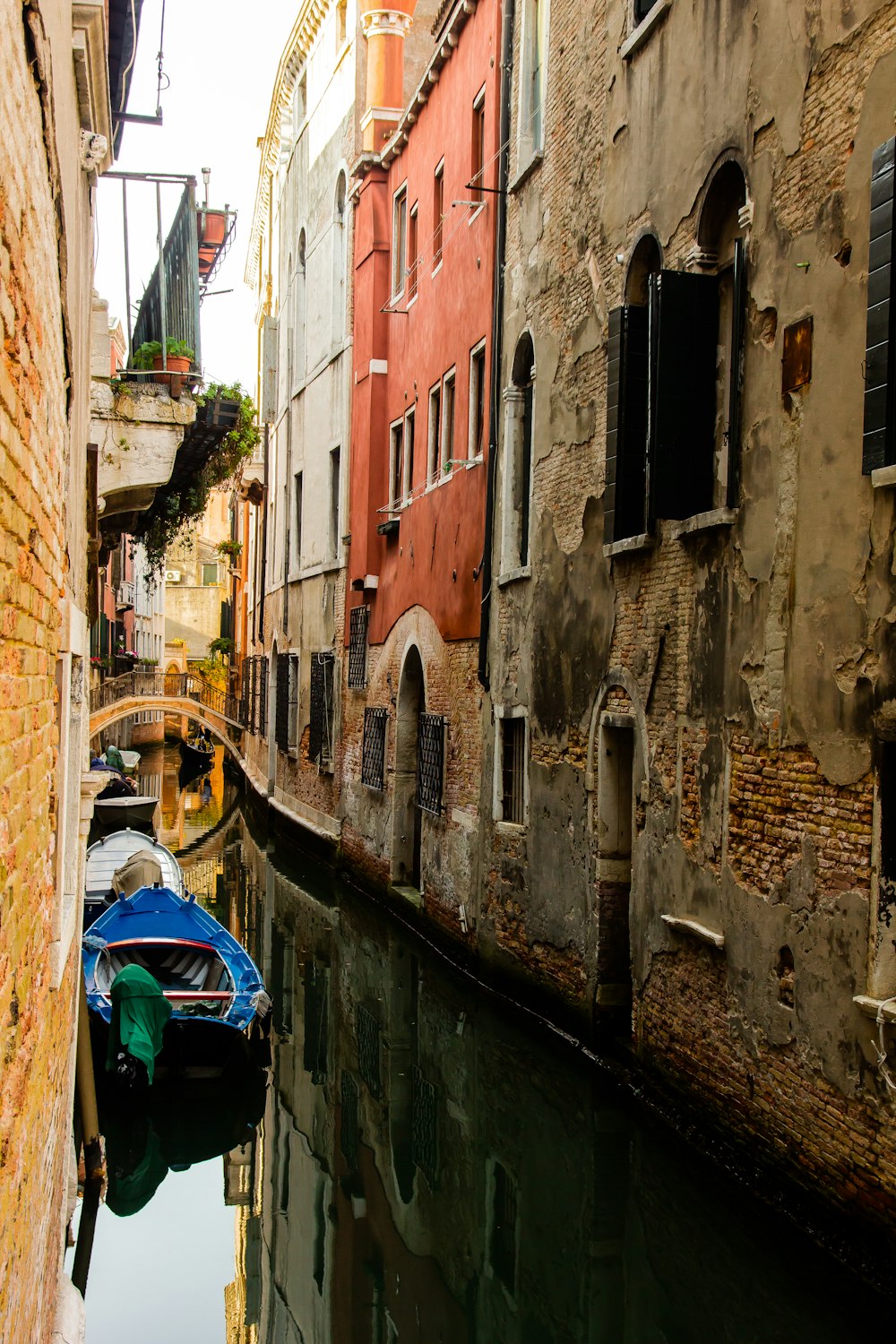 canal between brown building