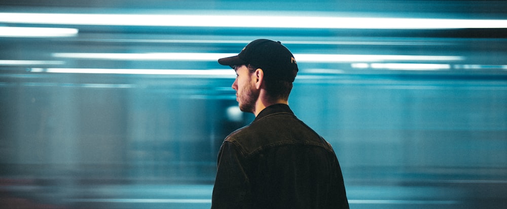 man wearing black baseball hat