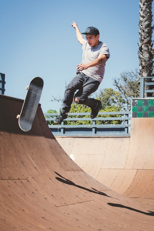 man making tricks of skateboard in Cayucos United States