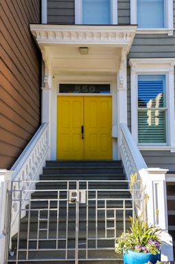 Front entrance of Golden Door Point building during daytime