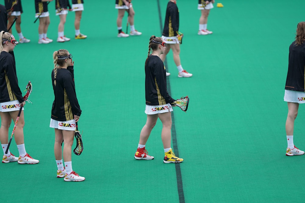 group of person playing playing lacrosse