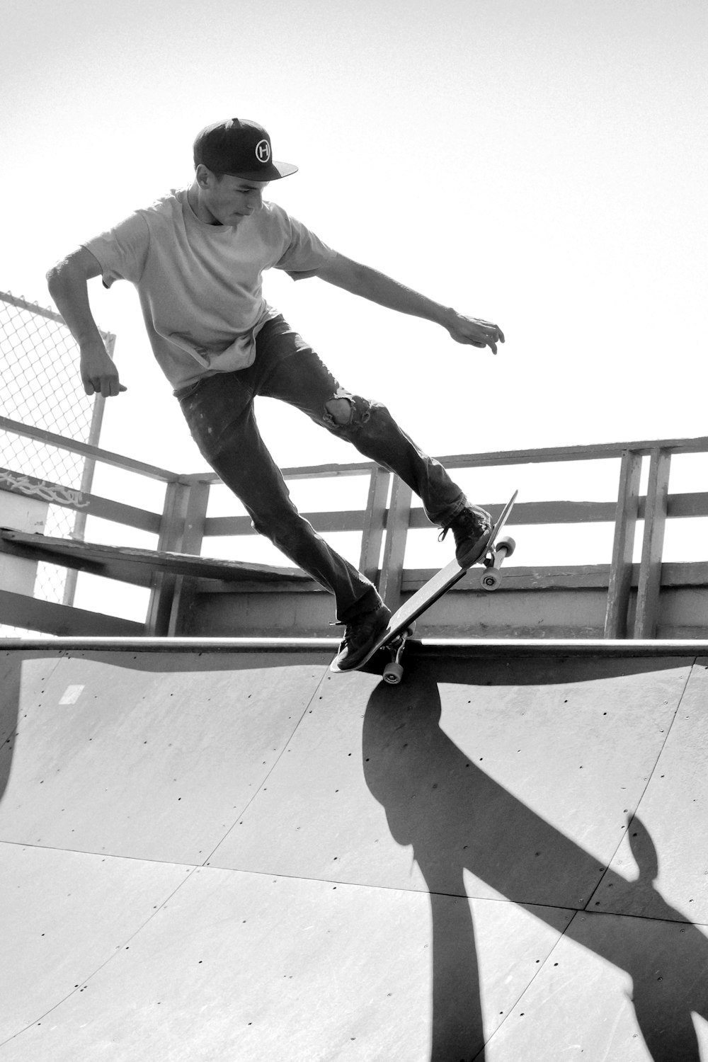 grayscale photo of man on skateboard