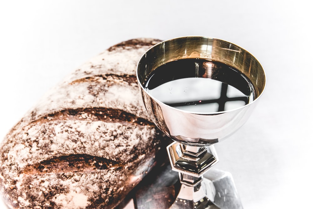 brass chalice and brown bread