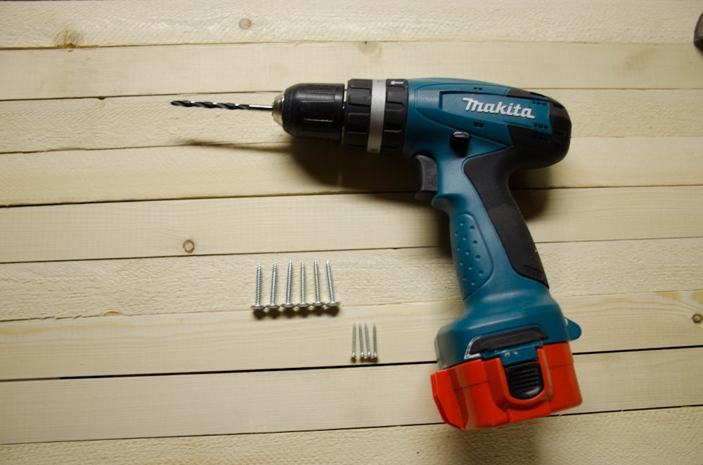 blue and black Makita drill