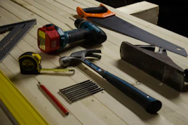 blue claw hammer and blue and black power drill