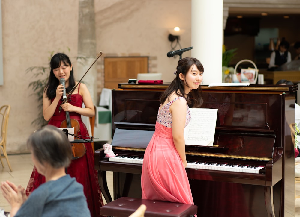 woman standing on piano