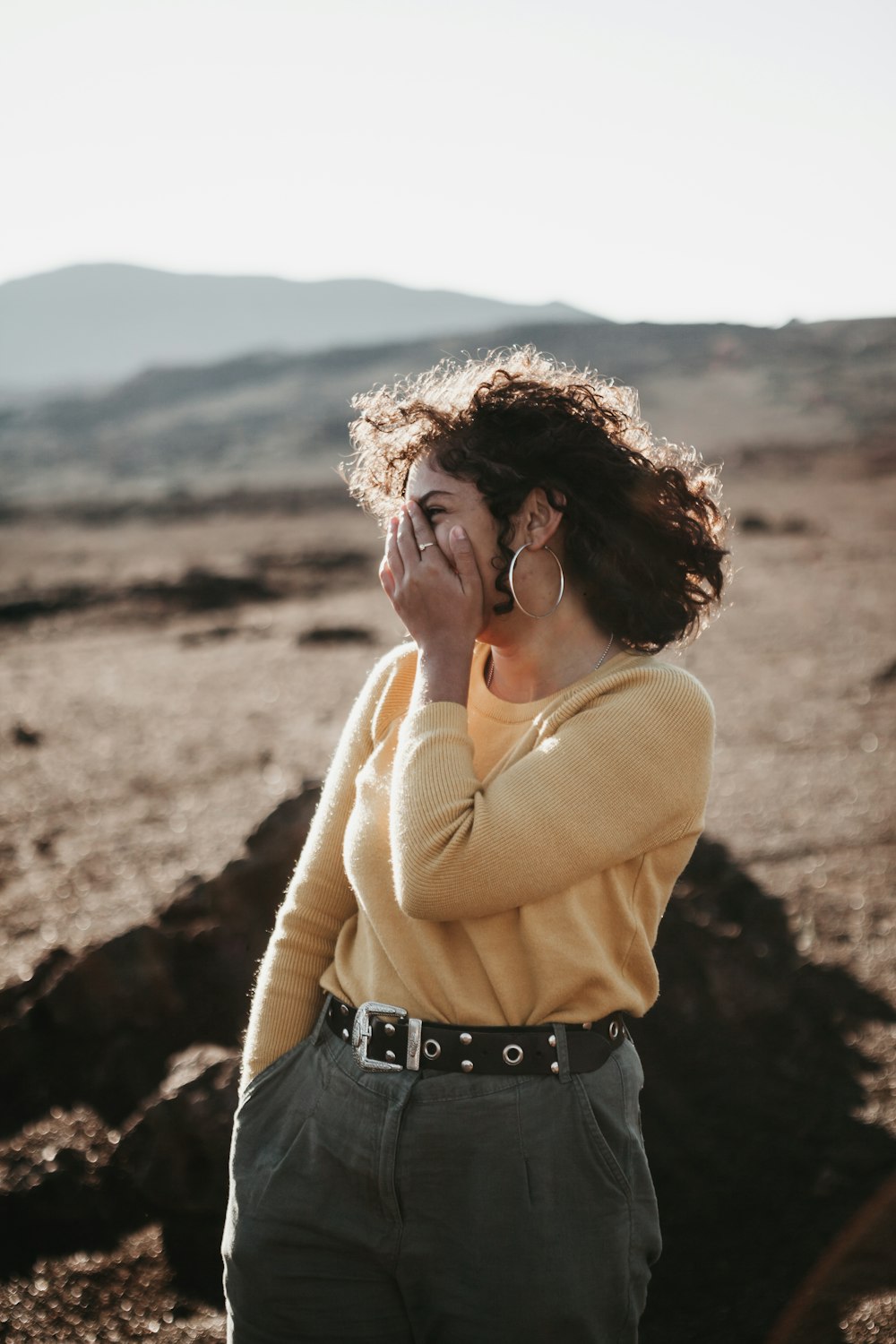 woman covering her face