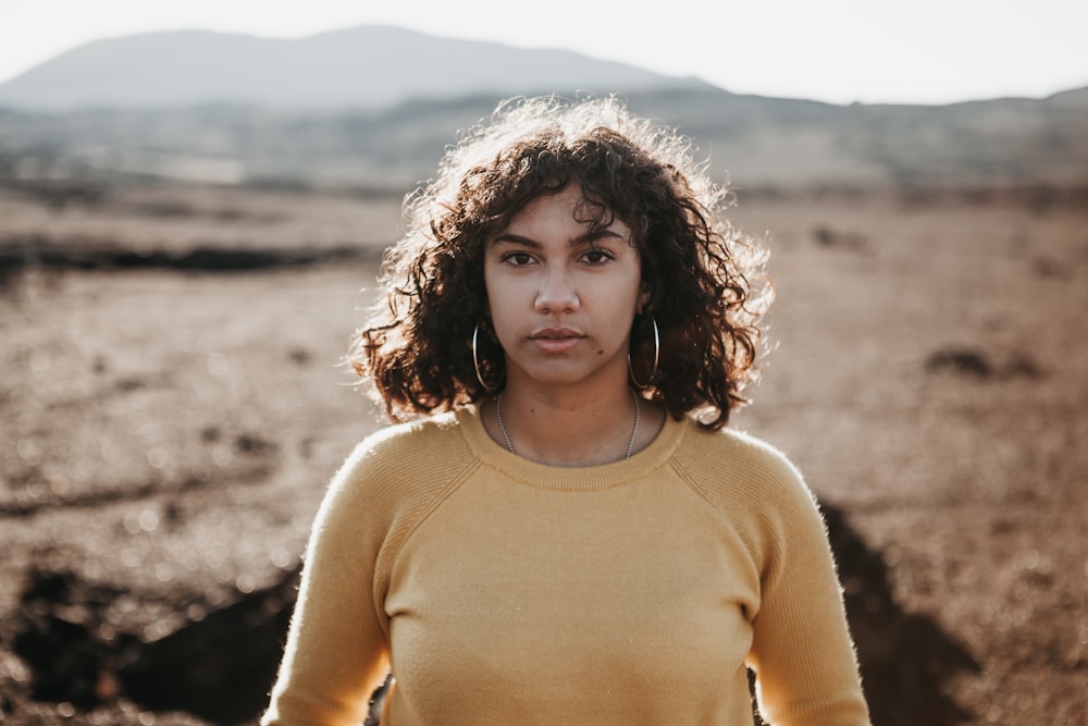 woman standing on field during daytime