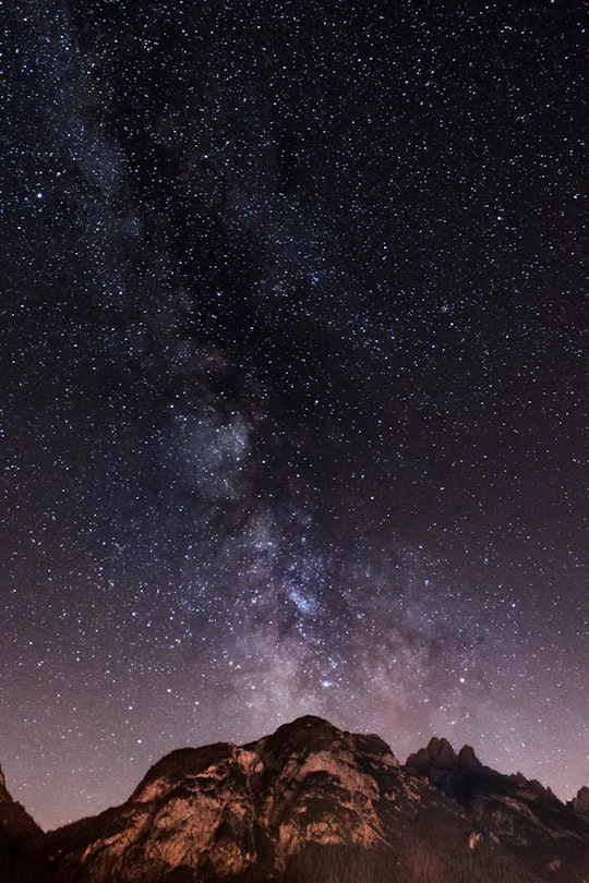 brown and black mountain during starry night in Sappada Italy