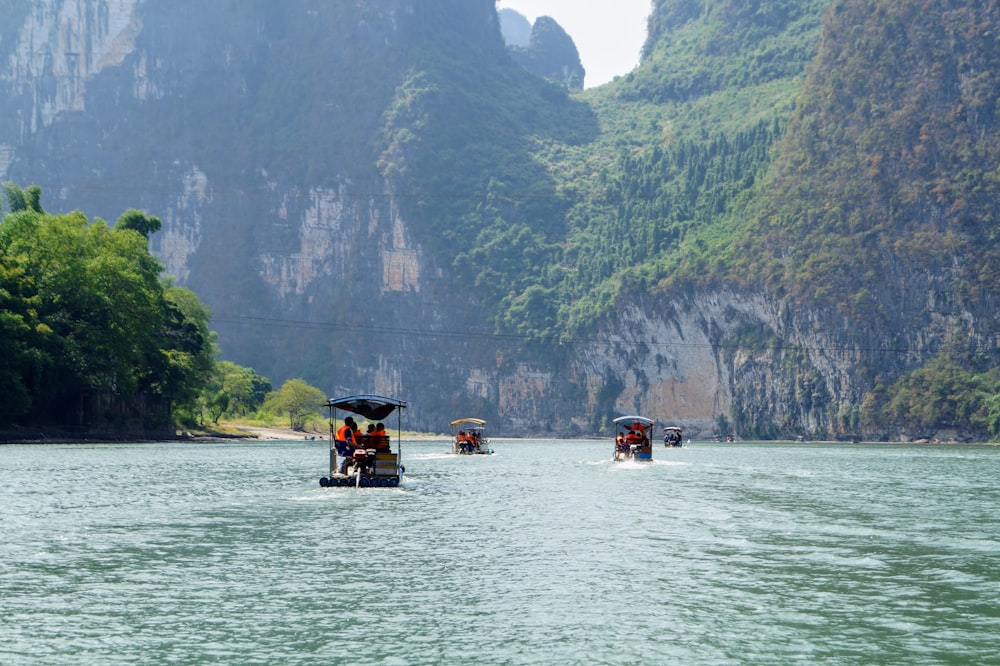 people riding on boat during daytime