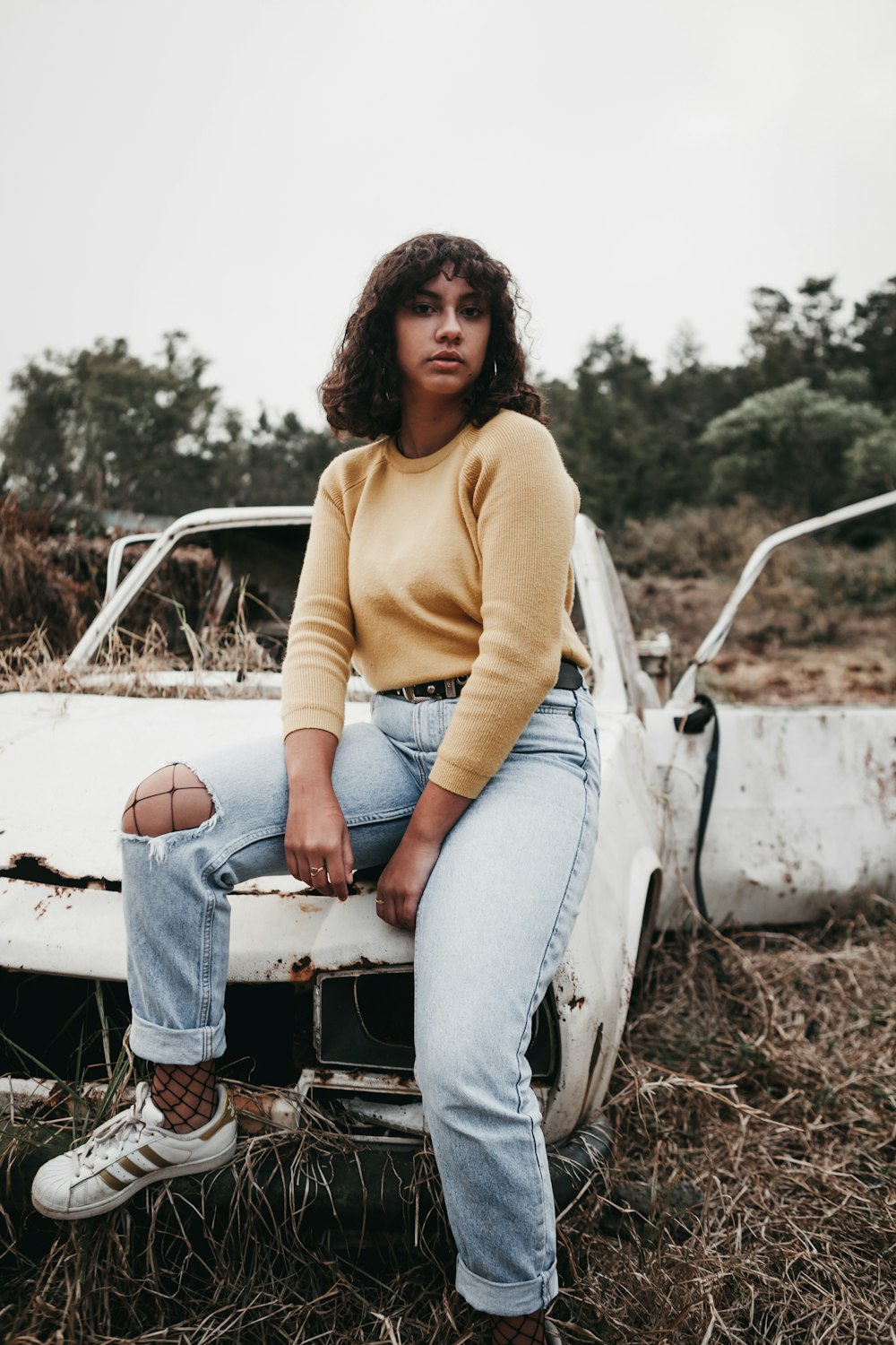 woman wearing yellow crew-neck sweater