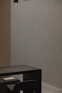 A minimalist dark-themed interface showing a restaurant table booking calendar.