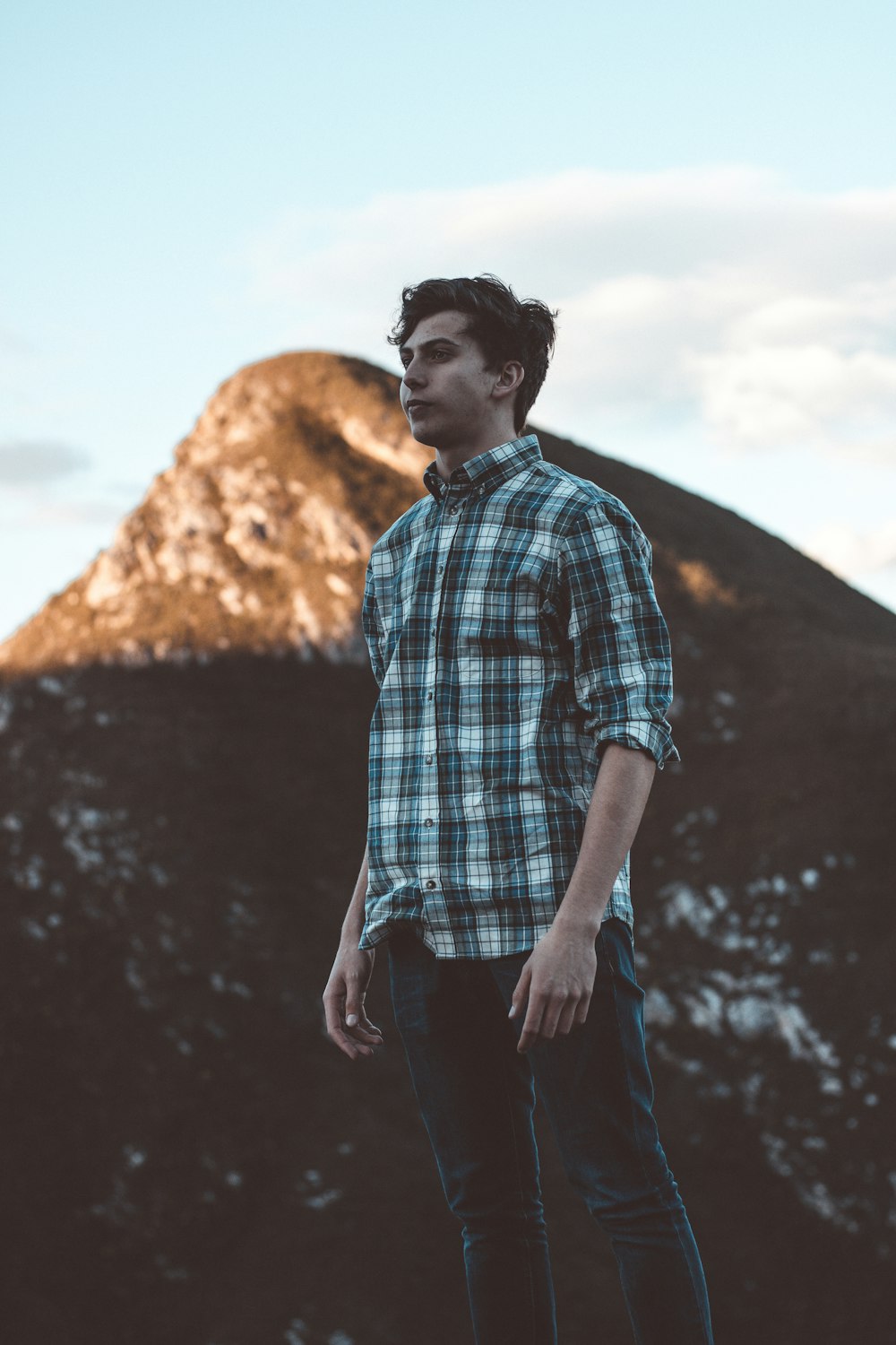 man wearing white and green plaid dress shirt