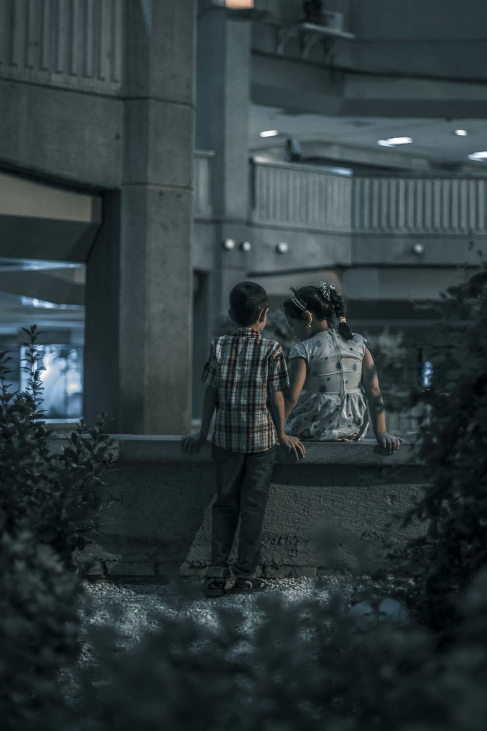 boy and girl near trees