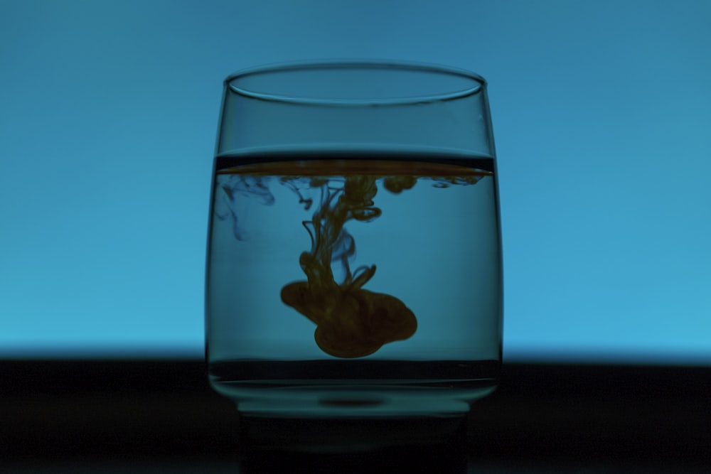 green smoke in drinking glass water