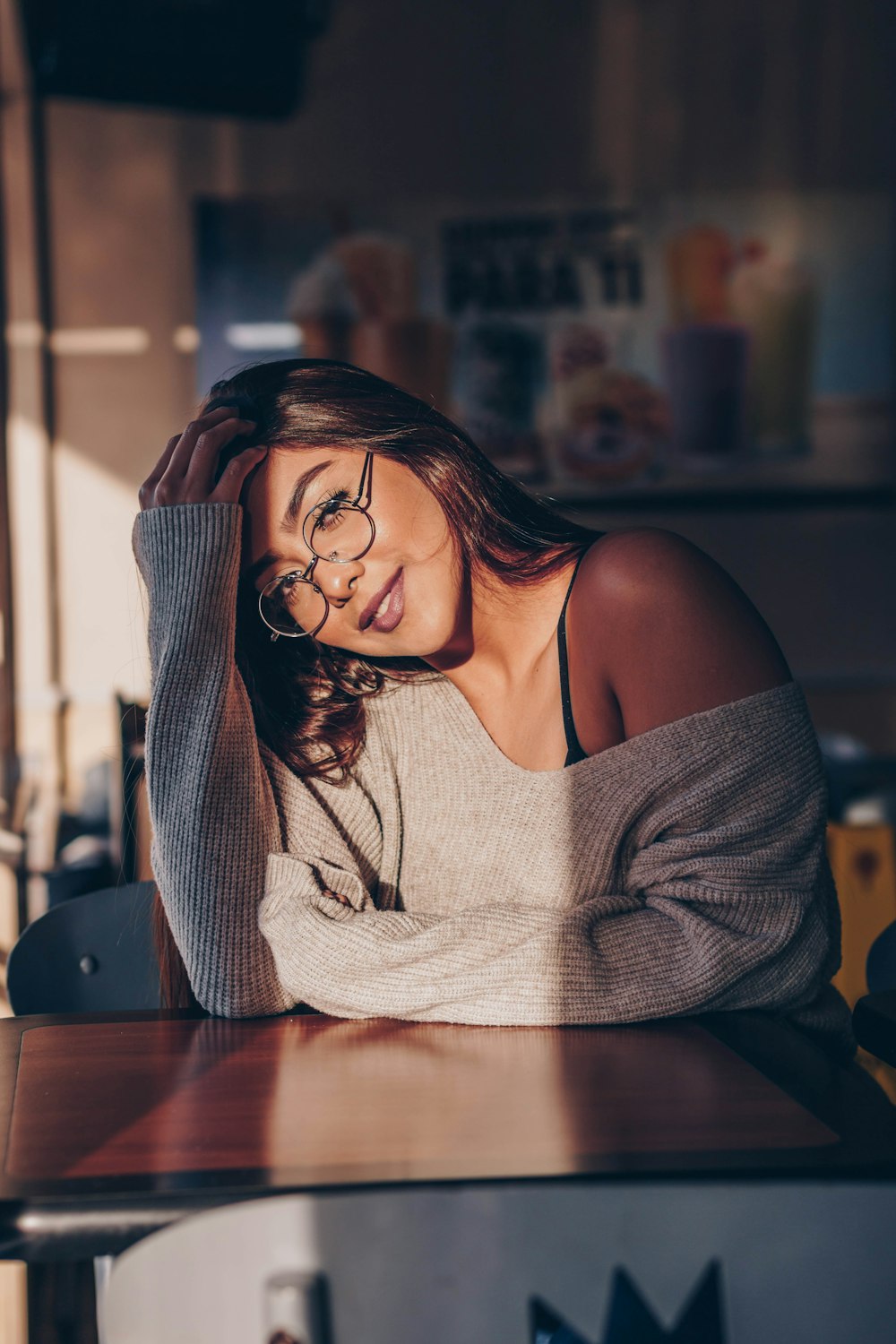 woman in gray off-shoulder long-sleeved top