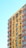 A multi-story residential building with a yellow facade, featuring numerous windows. Each window is equipped with an air conditioning unit. The building is accented with red horizontal lines separating each floor. The sky is clear and light blue in the background.