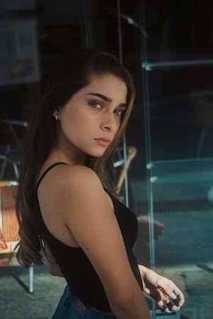 woman wearing black spaghetti strap top
