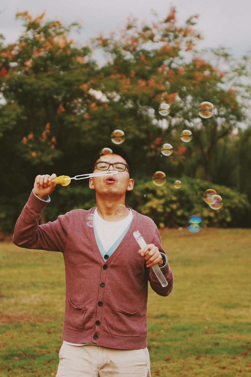 man playing bubbles