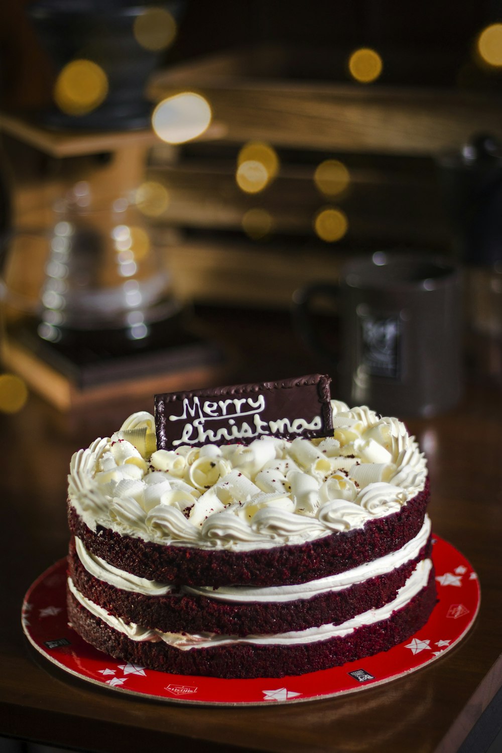 Merry Christmas chocolate cake on table