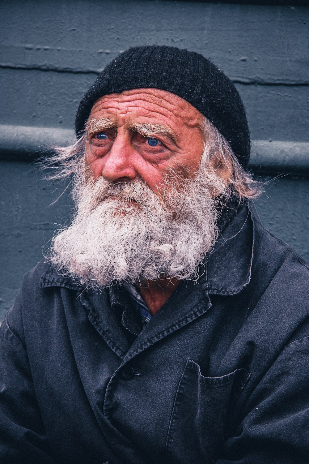 man in black beanie hat and black button-up jacket