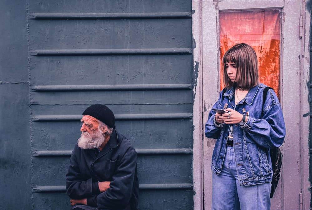 woman near man sitting during daytime