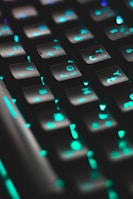 An old-school keyboard with green backlighting, evoking a retro tech vibe.