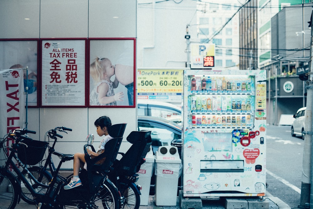 toddler in white shirt sitting on stroller