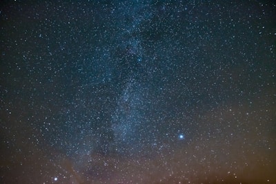 A mystical starry night sky with constellations mapped out in glowing lines.