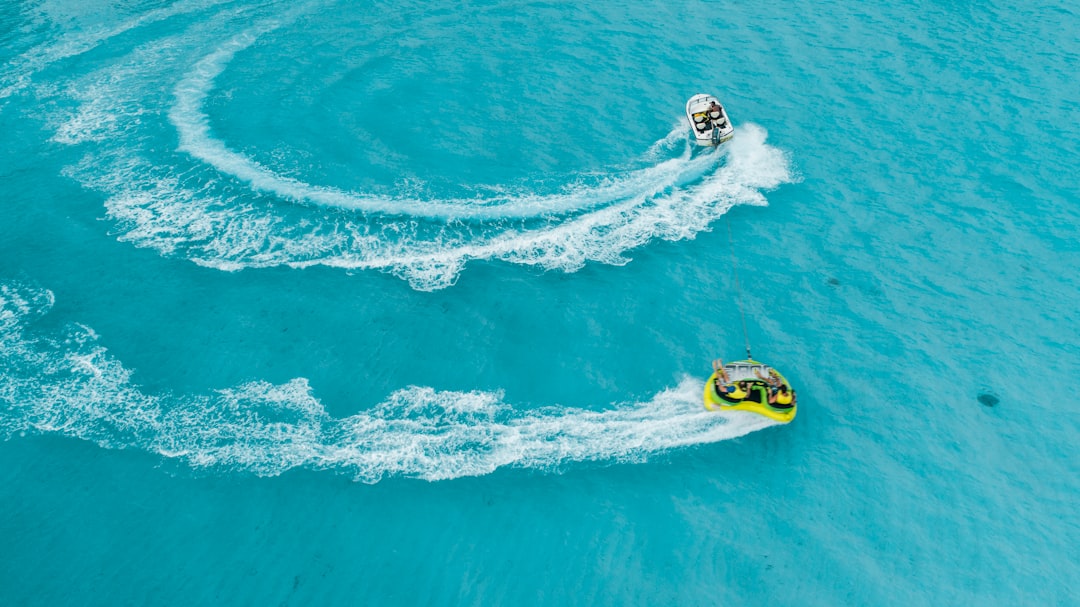 people riding towable tube