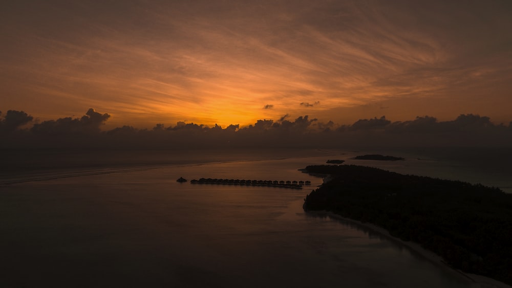 high-angle photography of island surrounded by body of water