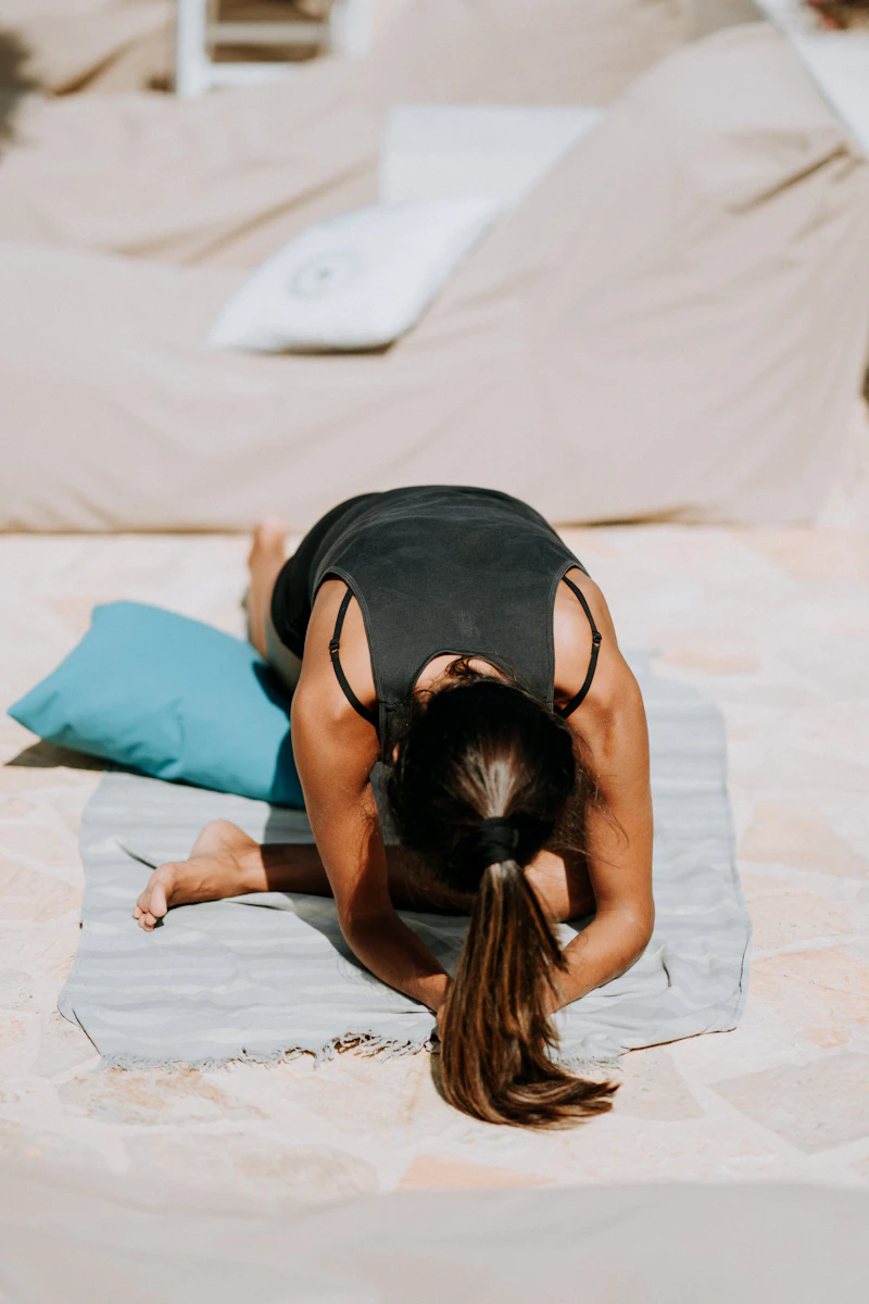 Soft yoga studio nook with bolsters, blocks, and mats