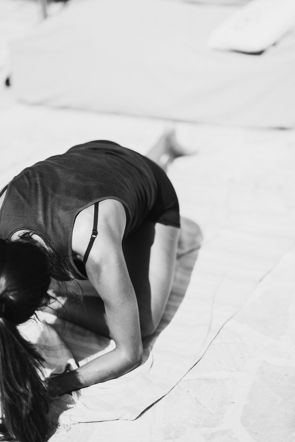 woman kneeing on textile