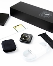 An elegant display of various mobile accessories including smartwatches and chargers.
