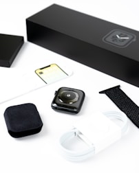 Smartwatch and fitness accessories neatly displayed on a white background.