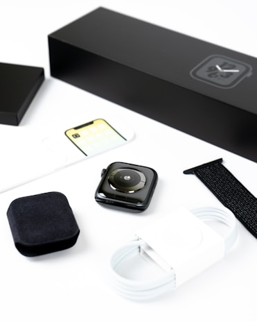 An elegant display of various mobile accessories including smartwatches and chargers.