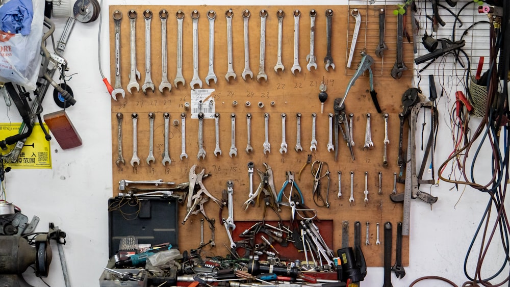 assorted-color tools on wall and table