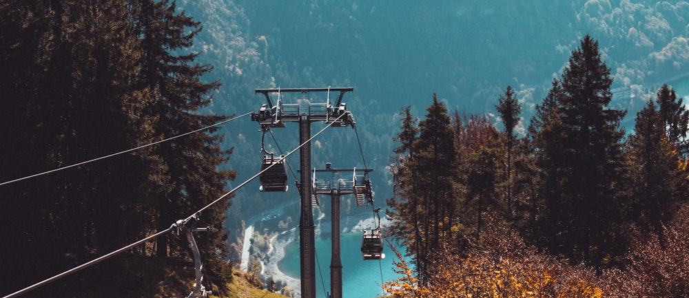 a ski lift going up a mountain side