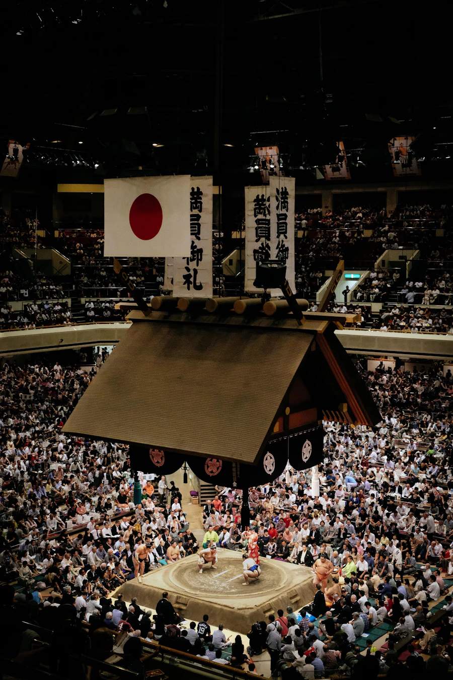 A crowd watching Zuma wrestling inside a stadium