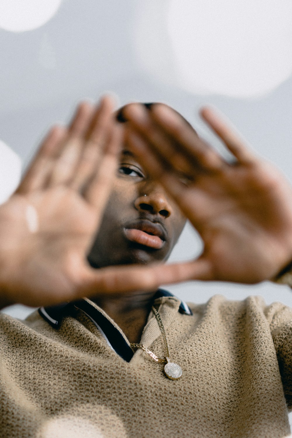 man wearing brown polo shirt