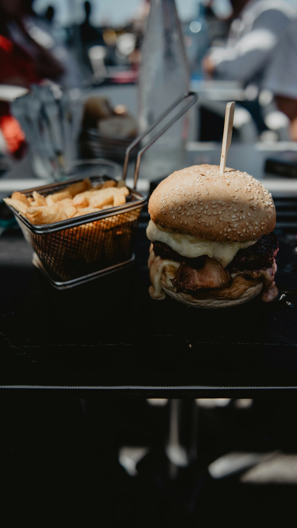 burger with patty beside fries