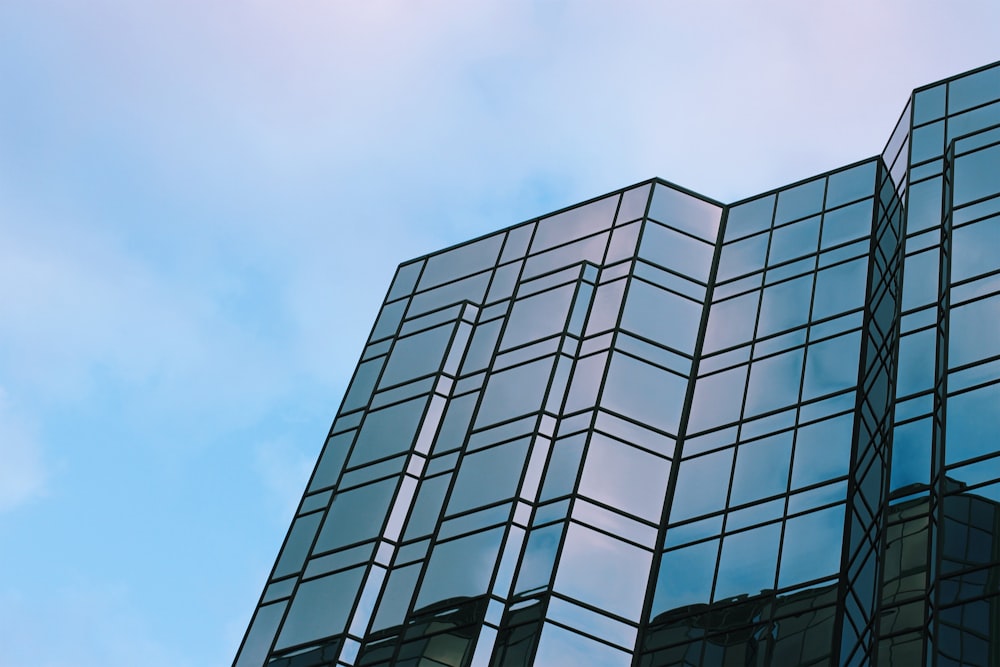 low angle photography of blue building