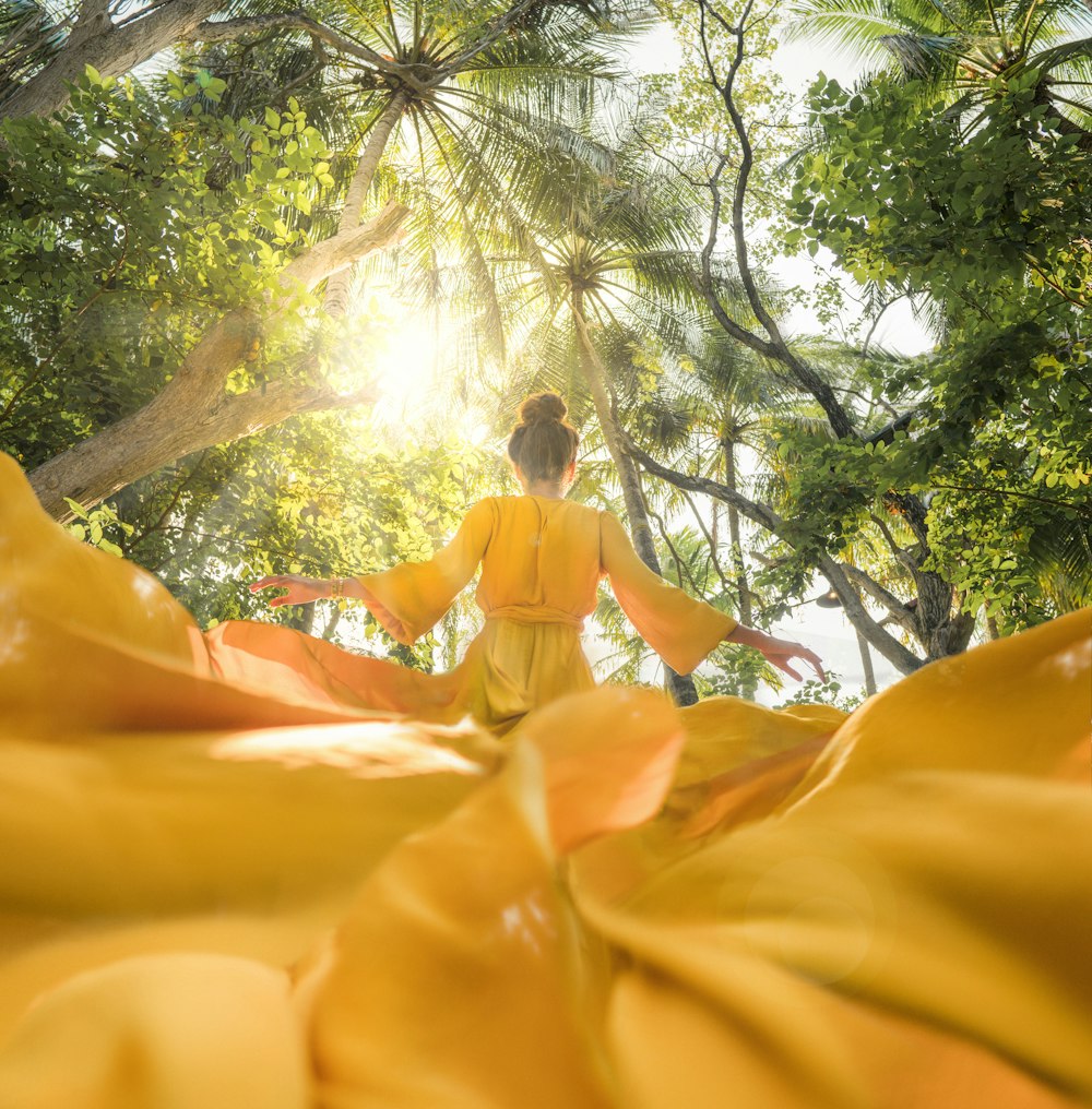 woman wearing yellow long-sleeved dress