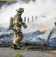firefighter watching of burning plank