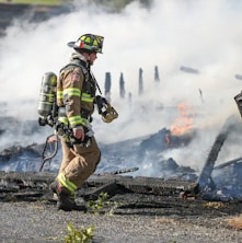 firefighter watching of burning plank