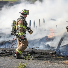 firefighter watching of burning plank